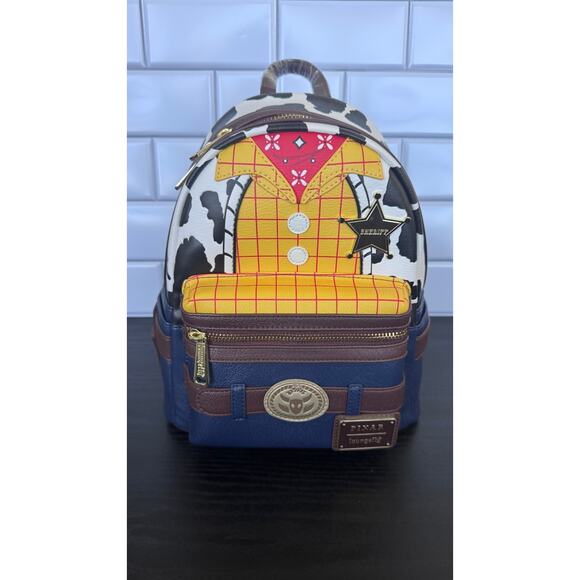 Loungefly Handbags - Disney x Loungefly Pixar Toy Story Sheriff Woody Toy Story Mini Backpack NWT